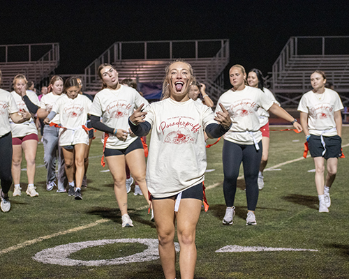 The Phi-Os come on the field for the Homecoming 2025 powderpuff football game.