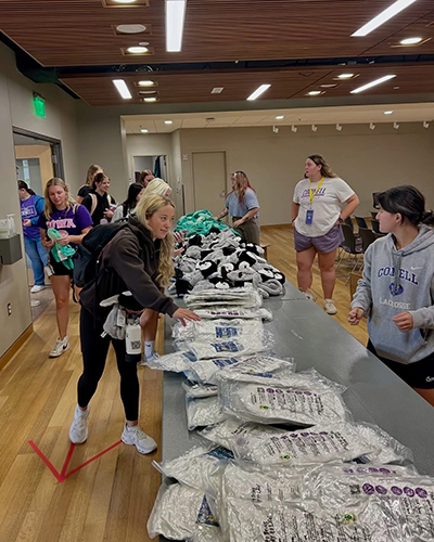 Cornell students go through line collecting the parts for their stuff-a-critter.