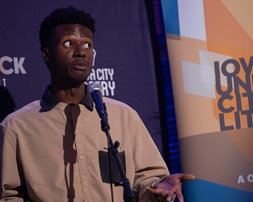 Henry Morray performing on stage.