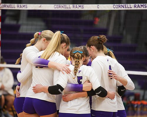 The Cornell College volleyball team wearing teal ribbons at the Morgan's Message dedication game.