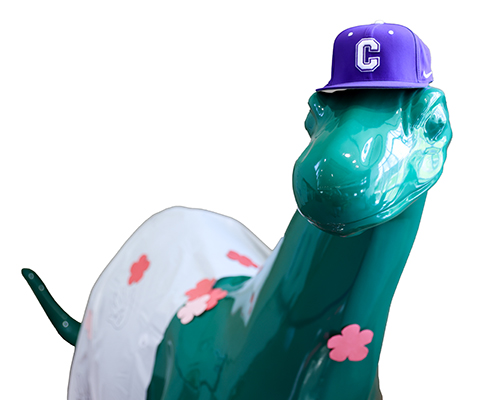 Norton the Sinclair Dinosaur poses for a photo with his Cornell hat on.