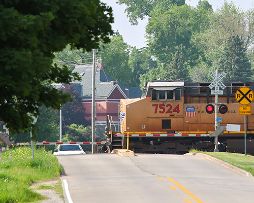 A train engine as it passes through one of the railroad crossings in Mount Vernon.