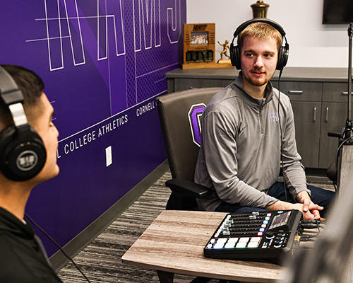 Carlson interviews Tony Gomez ’25, running back for the Rams football team, during one of his podcasts.