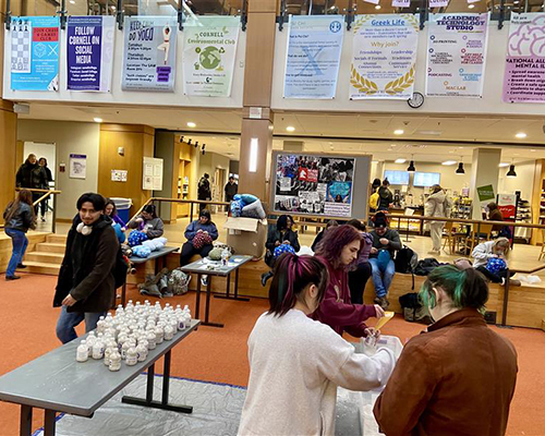 Day of Service 2025 participants put together sand bottles for the elderly.