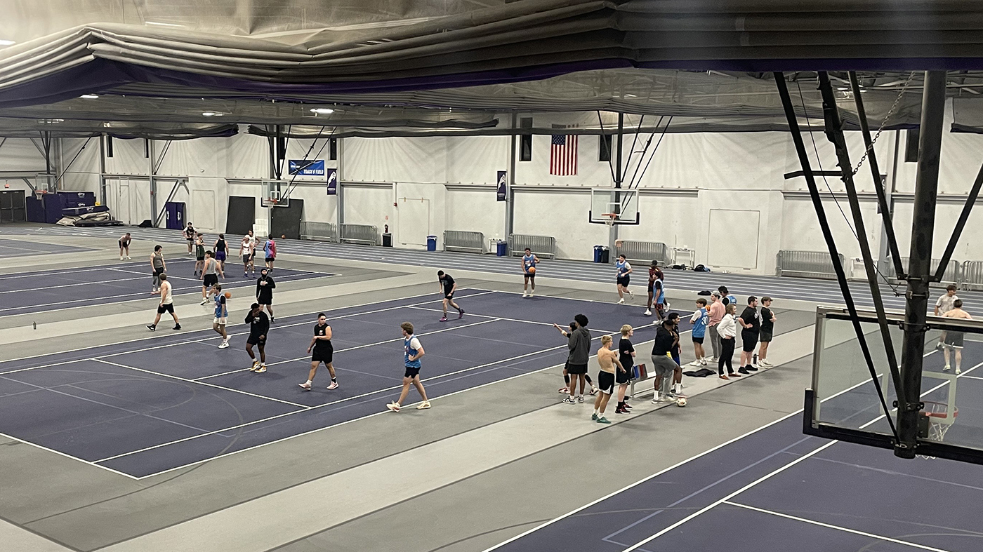Groups of Cornell students are shooting hoops as part of the intramural basketball game in Block 4 of the 25-26 school year.