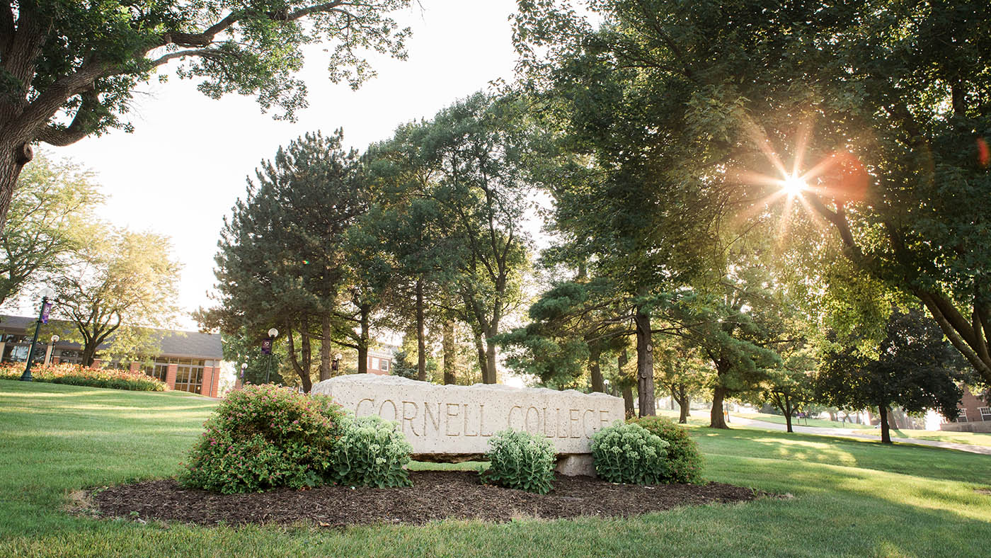 Sign out in front of Cornell College with the sun shining on it.
