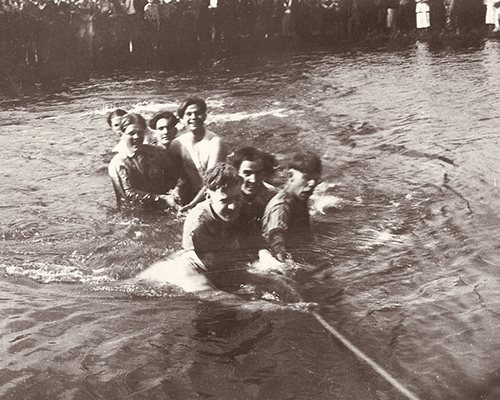 A black and white photo from the Cornell Archives of a game of tug-o-war 