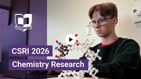 Video play button on top of image of White in the lab. 