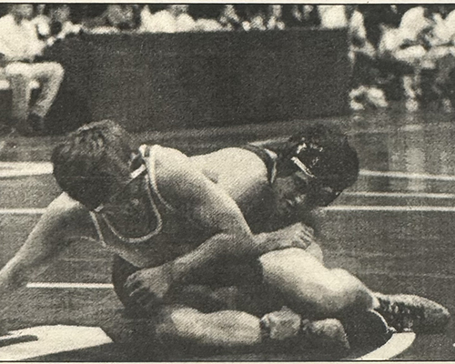 Drew Mundsinger '97 (right) wrestles in the Turkey Invitational his junior year. Photo by Emily Kenny '98.