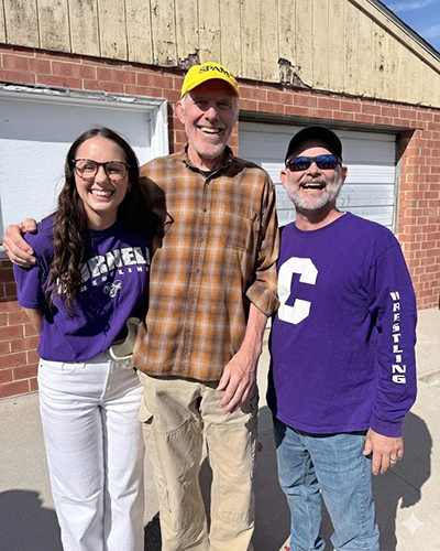 From left: Maddie Mundsinger '29, Coach Steve DeVries, Drew Mundsinger '97