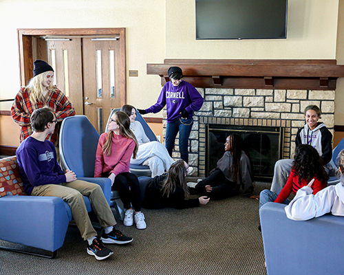 Students chatting in the Pfeiffer Hall lounge.