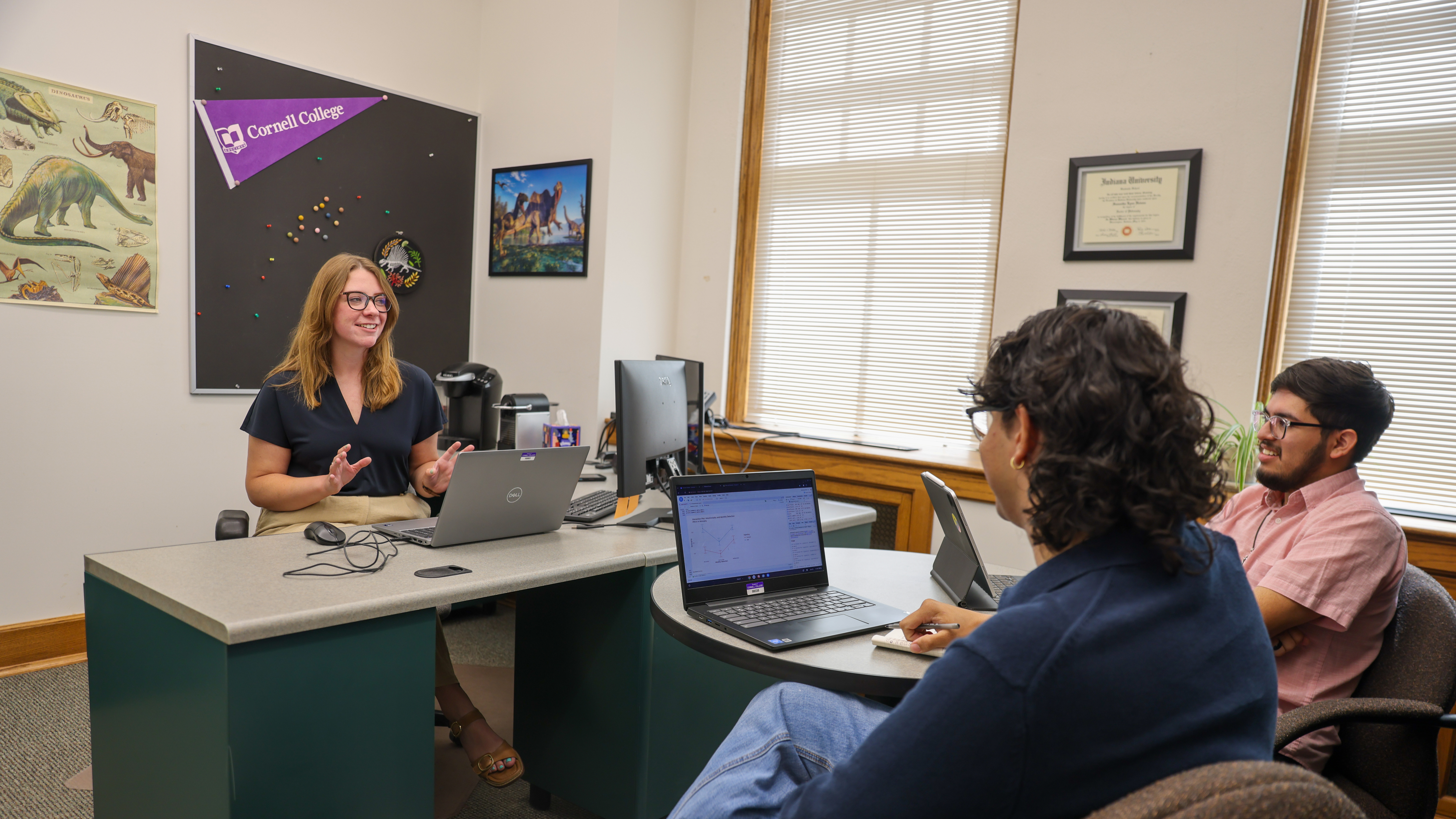 Assistant Professor of Psychology Samantha Heiman, Román Bonilla, and Valentin Andrade ’27 discuss their findings during CSRI 2026