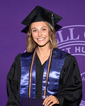 Ava Claussen-Tubbs in her cap and gown at Commencement 2026