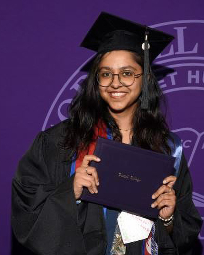 Smriti Neupane in her cap and gown at Commencement 2026