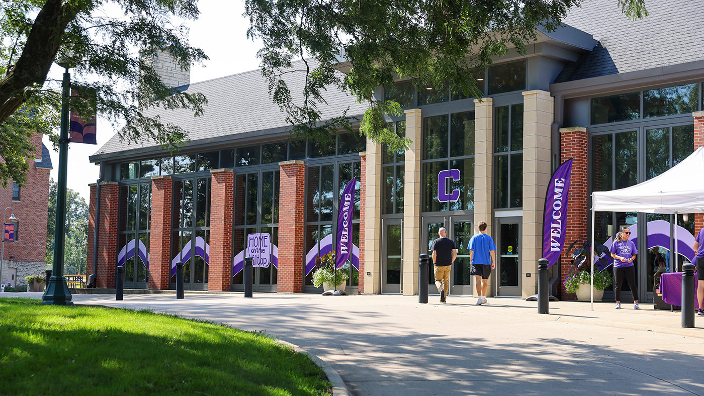 The Thomas Commons decorated with window drawings and flags to welcome the newest students to the Hilltop.
