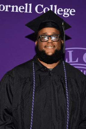 Malcolm Woodson in his cap and gown at Commencement 2026