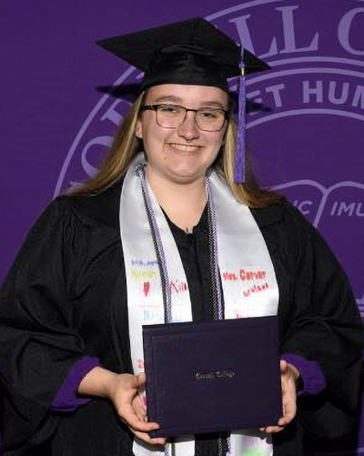 Jessica Ziemiecki in her cap and gown at Commencement 2026.