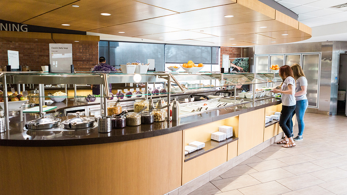 Students get food from the salad bar at the Hilltop Cafe.