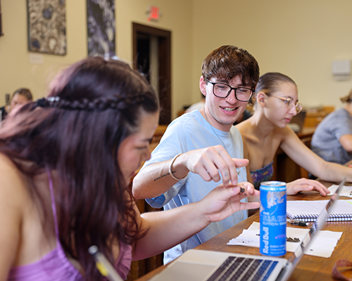 Students work on a soil project together.