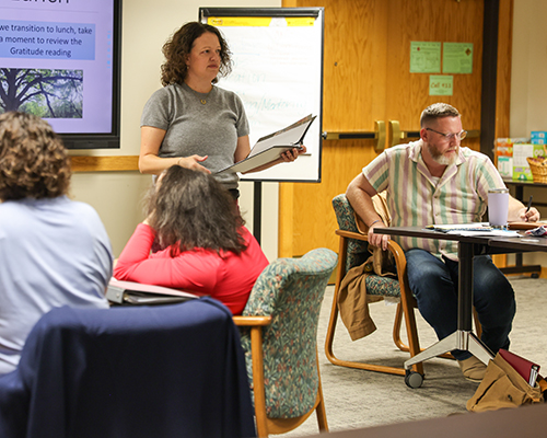 Chaplain Melea White discusses an activity with the group.