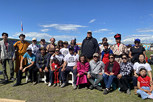 Nicholas Yelkin '25 and Julia Clark '06 pose in a group photo with the other people Nomad Science worked with in Mongolia
