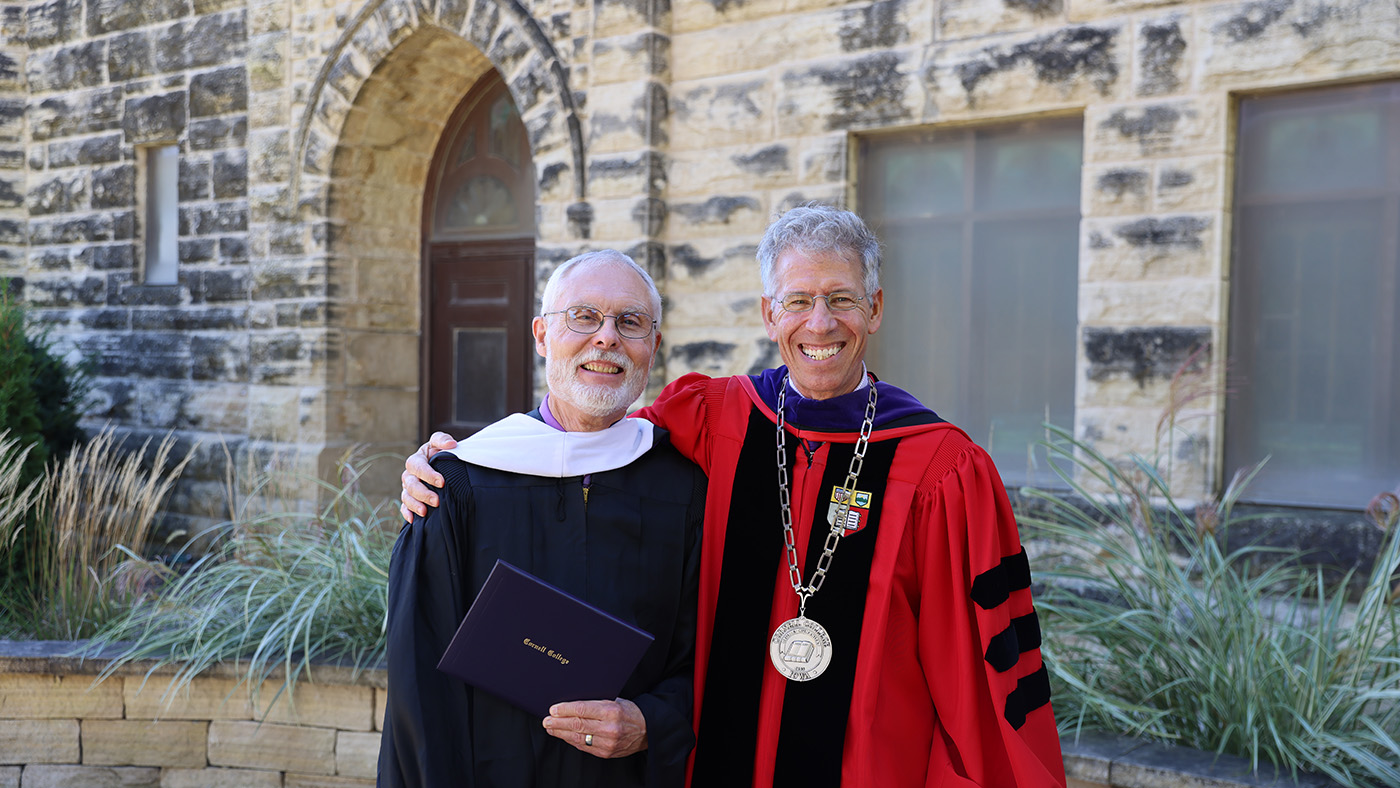 Mark Van Etten '76 holds the 2026 Leadership and Service Award he received during Homecoming Weekend.