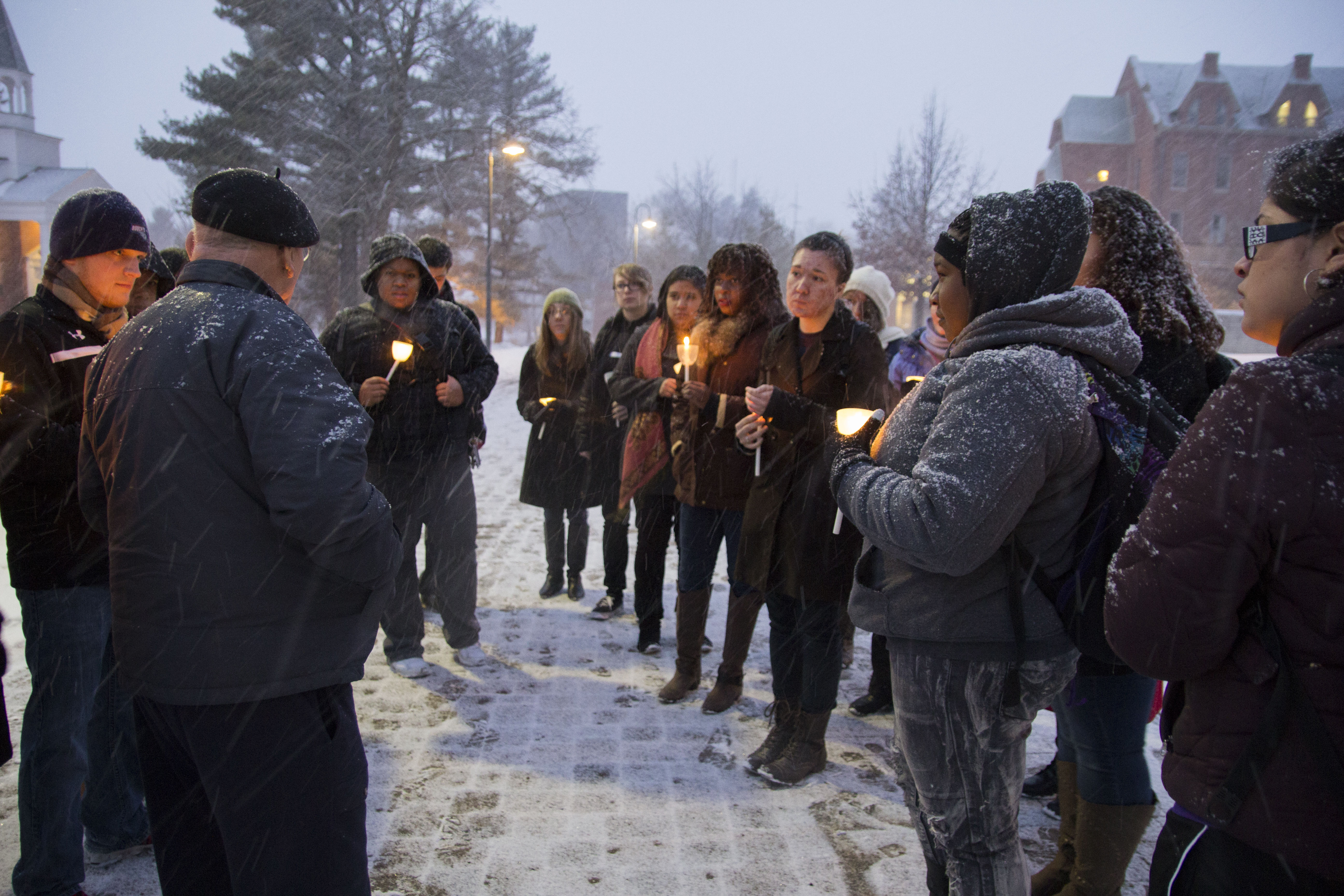 The Rev. Richard Thomas gathers with current students in January to honor Martin Luther King Jr. and Nelson Mandela and to reflect on their contributions to freedom and equality during MLK week at Cornell. Tiffany Monreal ’14