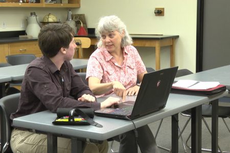 Picture of Professor Kara Beauchamp working with Marshall Hobson-Ritz