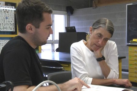 Professor Condon and Ben Garcia '19 looking at data