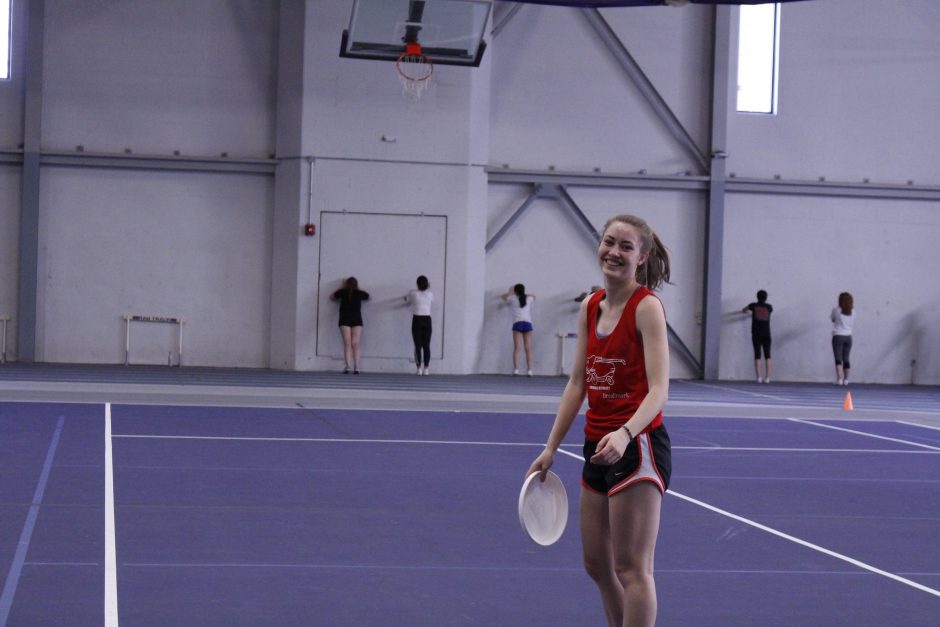 Students playing ultimate frisbee