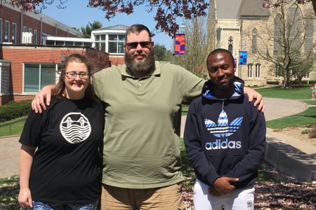 Group photo of Dylan Davison, Wesley Adcock, and Suleiman Shehu on the Cornell College campus