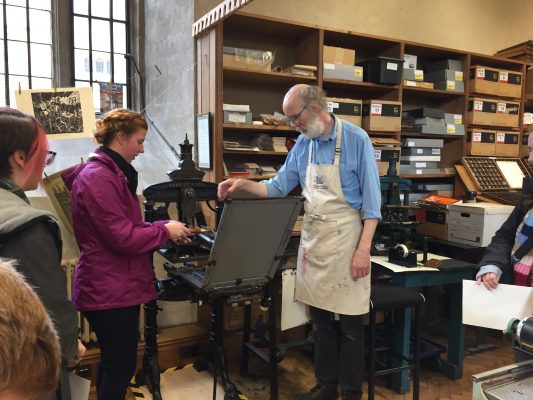 Hannah Robertson '18 learns about book making.