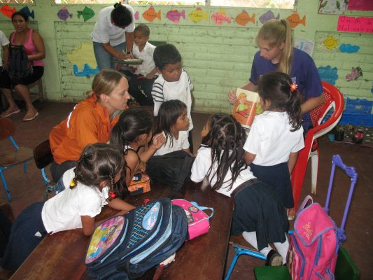 Members of the Cornell volleyball team read and deliver books to rural schoolchildren during a 2011 trip to Nicaragua.