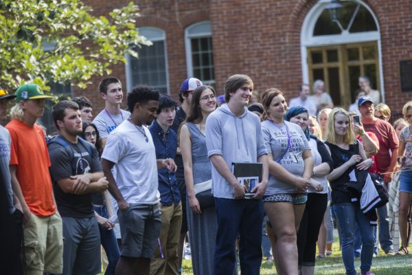 Students watch as speakers welcome them to campus.