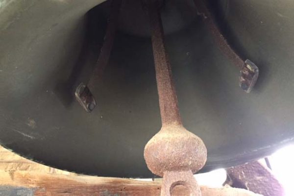 Picture of the underneath side of an old bell in King Chapel