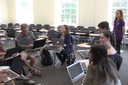 Photo of students and professor in a classroom