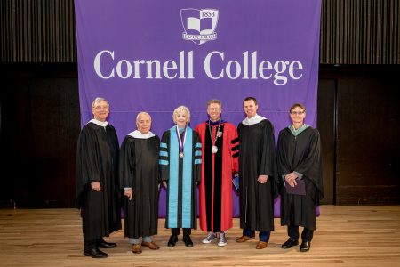 (left to right) John Toussaint ’78, Doug Michaels ’64, Dorothy Ashbacher Lincoln-Smith ’58, Eric Sudol ’03, Kenneth Patterson ’83 in front of Cornell College banner