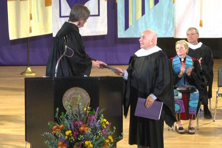 Doug Michaels '64 accepting award for Flora Shriver Bowers '63