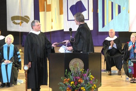 John Toussaint '78 receiving Homecoming award