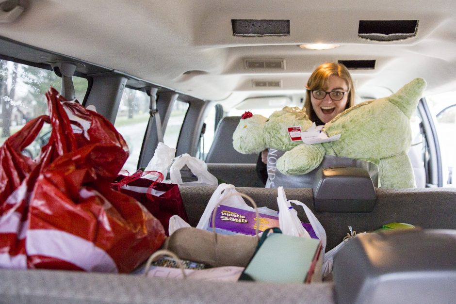 Hannah Ganzel in the van with an excited look on her face.