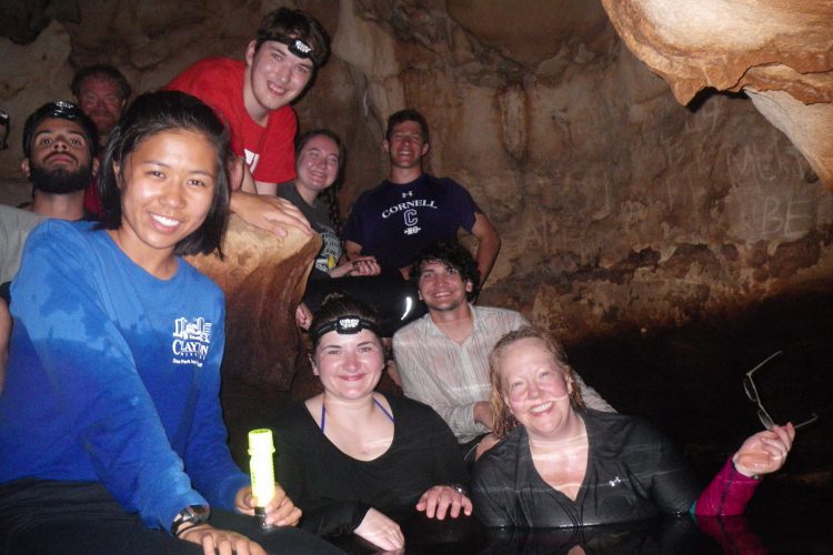 Professor Stewart (at right) and students in a Bahamian cave. 
