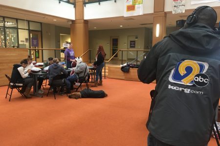 KCRG photographer takes video of student working on service projects