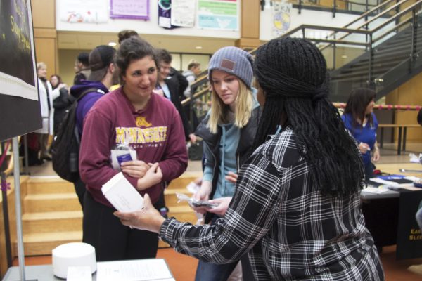 Marcia Sisk talking with students