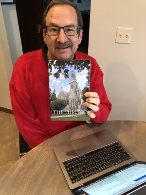 Michael Bellito ’72 holding his book “The Hilltop (A College Tale)”