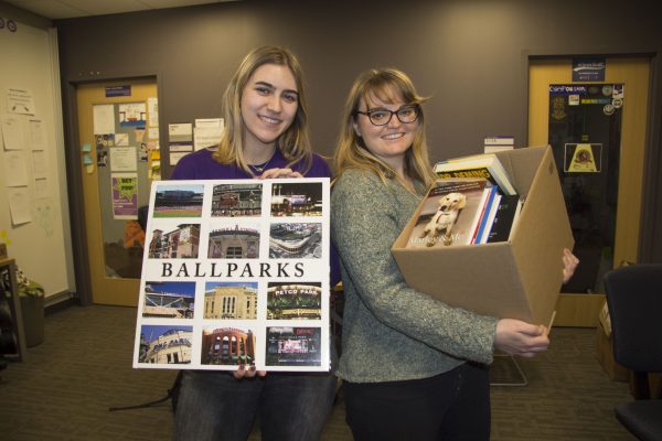 Lexi Woywod ’21 (left) and Hannah Ganzel holding books 