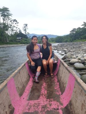 Guerra sitting in a canoe with a second woman.