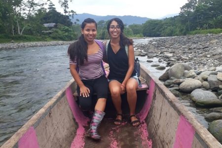 Guerra sitting in a canoe with a second woman.