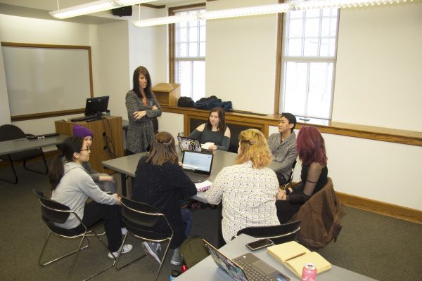 Melinda Green meets with her Cornell student team for research updates