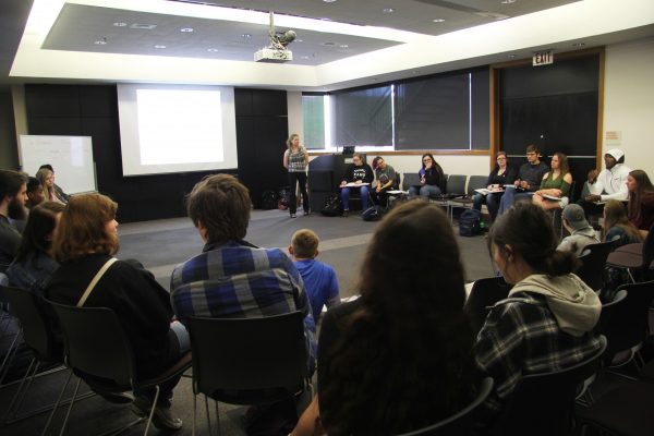 Cornell students and high school students introduce themselves during a class with Rebecca Wines