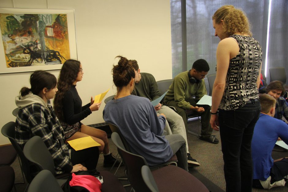 Cornell students work in groups with high school students